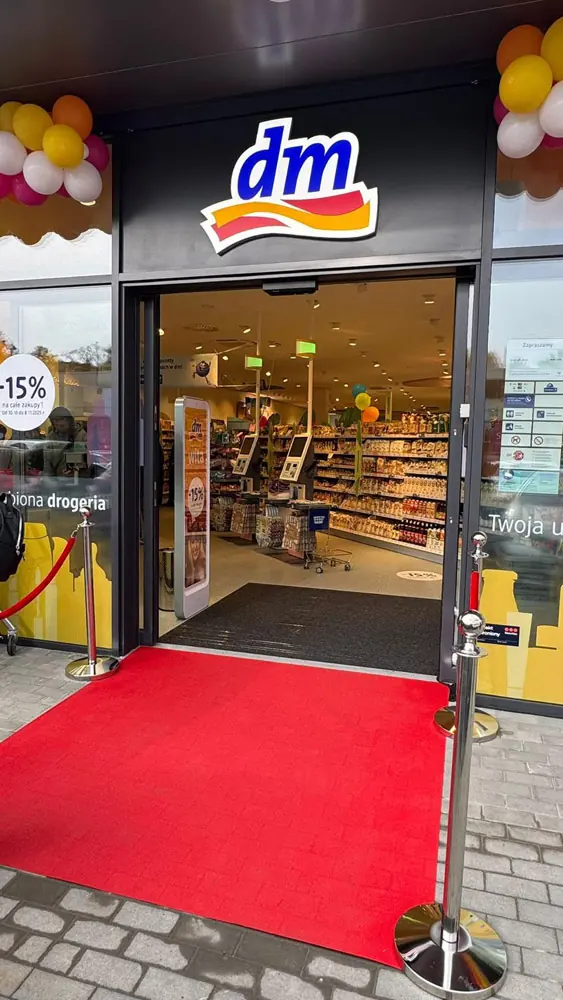 Store entrance with a red carpet on the opening day