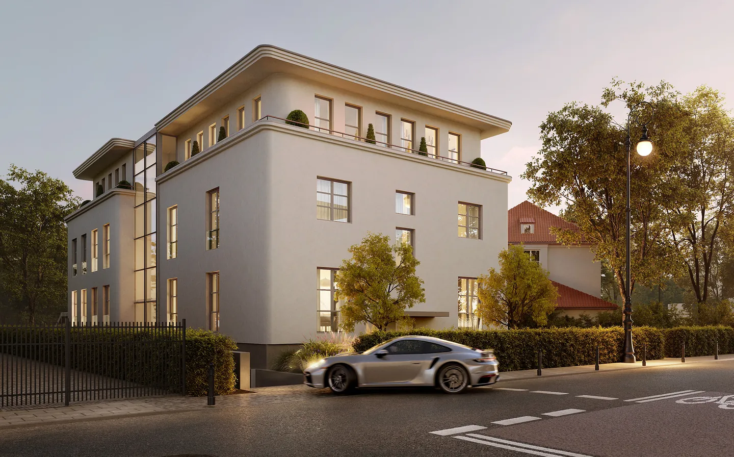 Visualisation of the M12 Residence villa on ul. Mścisławska at dusk, with roof terraces and a street lamp