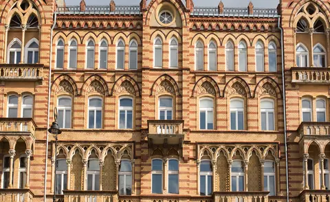 Historic brick façade of the U22 Residence tenement building in Warsaw's Śródmieście