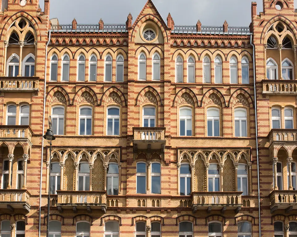 Historic brick façade of the U22 Residence tenement building in Warsaw's Śródmieście