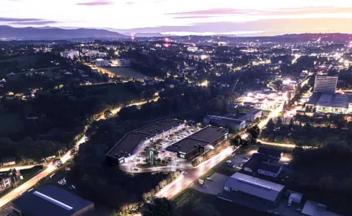 Nocna wizualizacja Viva Park Cieszyn z lotu ptaka na tle panoramy miasta